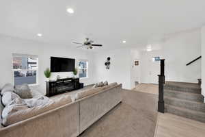 Living area featuring stairway, recessed lighting, light wood-type flooring, and ceiling fan