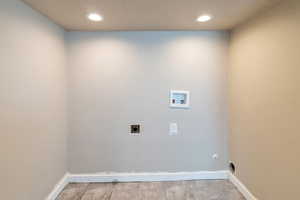 Washroom with baseboards, laundry area, recessed lighting, hookup for a washing machine, and hookup for an electric dryer