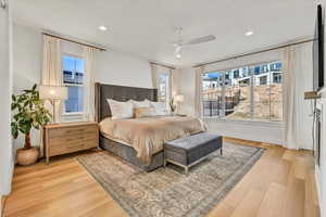 Bedroom featuring recessed lighting, wood finished floors, and baseboards