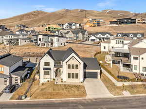 Drone / aerial view with a residential view and a mountain view