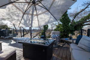 Wooden deck featuring outdoor lounge area.