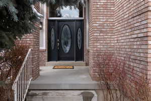 Front entrance with brick siding