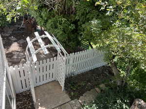 View of yard featuring fence.