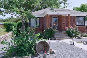 View of front facade featuring brick siding and xeriscaped yard