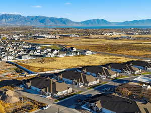 Aerial perspective of suburban area featuring a mountainous background