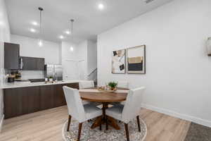 Dining area opens to a spacious kitchen full of elevated features