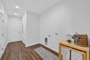 Laundry room with access to the garage and breezeway.