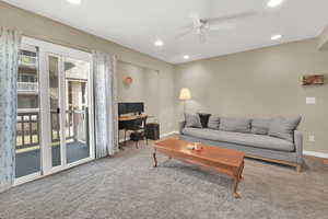 Living room w/ door to covered deck