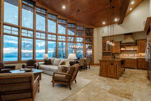 Living room featuring high vaulted ceiling, recessed lighting, wood ceiling, a chandelier, and a mountain view