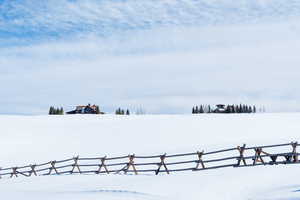 View of yard layered in snow