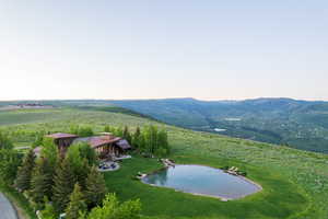 Aerial overview of property's location with a mountainous background