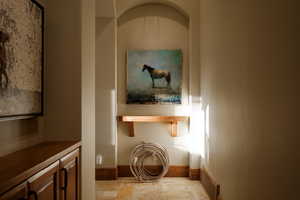 Hall with light stone finish flooring