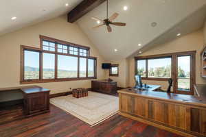 Office featuring dark wood-type flooring, beam ceiling, high vaulted ceiling, a ceiling fan, and recessed lighting