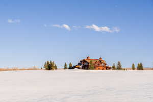 View of yard covered in snow