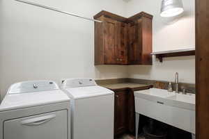 Washroom with cabinet space and separate washer and dryer
