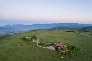 Aerial view of property's location featuring mountains and rural landscape