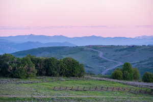 View of mountain background featuring rural landscape