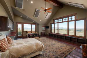 Bedroom featuring high vaulted ceiling, access to outside, beamed ceiling, recessed lighting, and wood finished floors