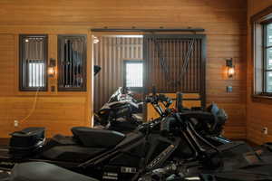 Exercise room with wooden walls and plenty of natural light