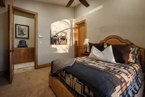 Bedroom with carpet and ceiling fan