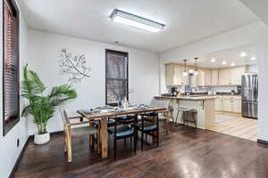 Dining space featuring recessed lighting, baseboards, and wood finished floors