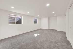 Basement with carpet flooring, recessed lighting, and baseboards