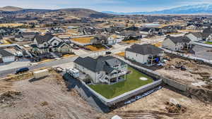 Drone / aerial view with a mountain view and a residential view. grass edited for the season