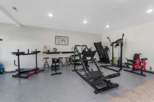 Exercise room featuring recessed lighting and visible vents