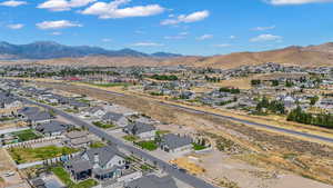 Aerial perspective of suburban area with a mountain backdrop