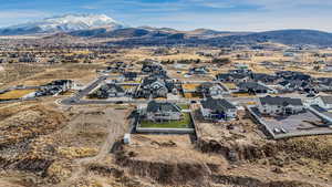 Bird's eye view with a mountain view and a residential view. grass edited for the season