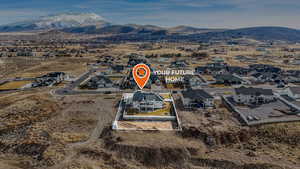 Drone / aerial view featuring a mountain view and a residential view
