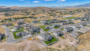 Aerial perspective of suburban area featuring a mountain backdrop