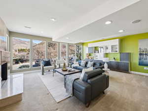 Living Room off of entry.  Floor to ceiling windows with access to front deck.