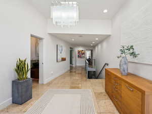 Entry with skylights leading to kitchen & family room