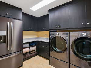 Laundry with front loading washer/dryer and refrigerator - all included