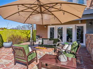 Lower level patio with firepit and electric screen for movie nights under the stars