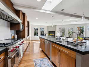 Kitchen & semi-formal dining area. Wolfe 4-burner gas range with griddle & grill and hood.