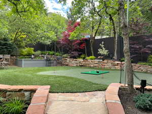 Summer view of putting green & raised garden beds