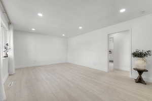 Unfurnished room featuring visible vents, recessed lighting, and light wood-type flooring