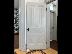 Hallway with light wood-style flooring