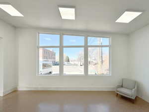 Interior space with speckled floor and baseboards