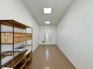 Interior space with a skylight and finished concrete flooring