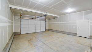 Garage featuring a garage door opener