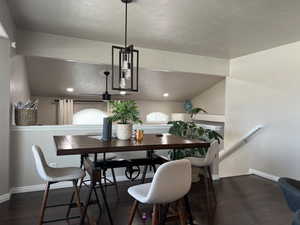 Dining space with baseboards and wood finished floors