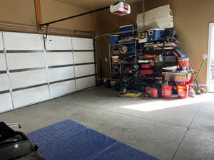 Garage featuring a garage door opener