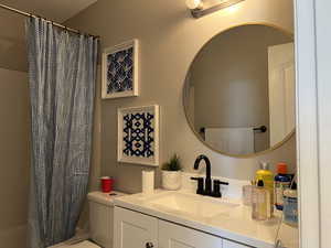 Bathroom featuring vanity and toilet