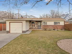 Single story home with a front yard, fence, an attached garage, a chimney, and concrete driveway