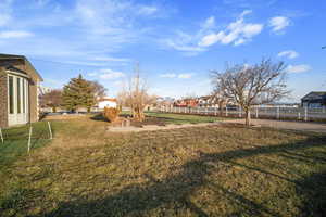 View of yard featuring fence