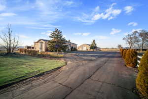 View of street featuring aphalt driveway