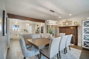 Dining area featuring recessed lighting and wood tiled floor